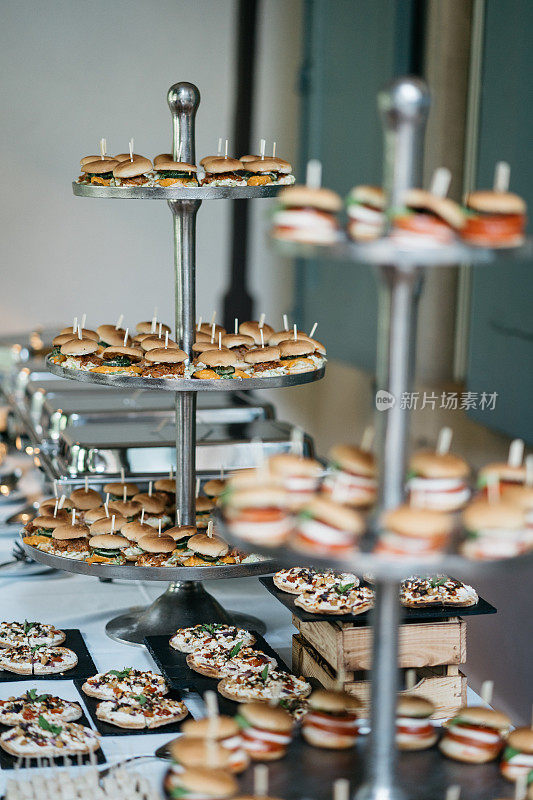 business lunch buffet of mini burgers and tarte flambée